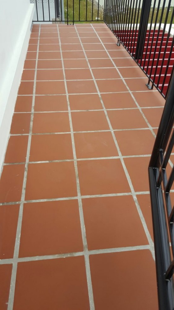 Matt textured red tiles for walkway paving